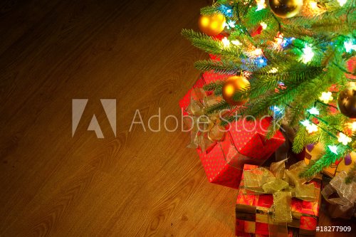 Christmas fir tree with colorful lights close up - 900636457