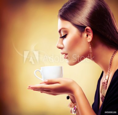 Coffee. Beautiful Girl Drinking Tea or Coffee - 900717440