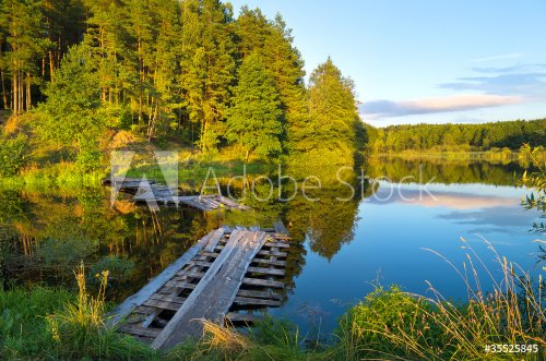 Colorful landscape with a wooden bridge over the river - 900065826