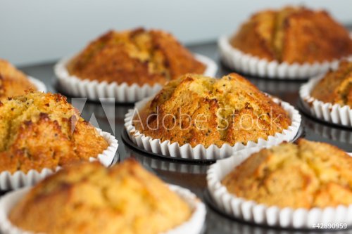 Delicious fresh homemade banana muffins in a baking tray - 901152521