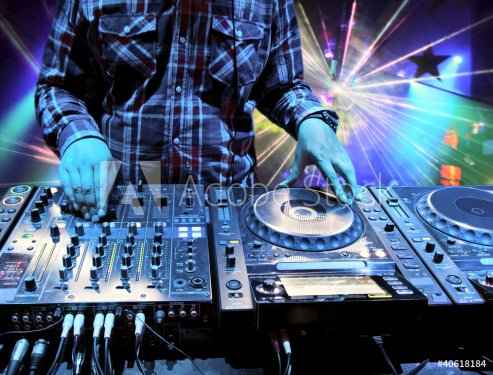 Dj mixes the track in nightclub at party - 900341322
