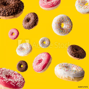 donuts fall on a yellow surface - 901152479
