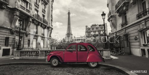 Eiffel Tower in Paris and retro red car at the  Avenue de Camoens - 901153999