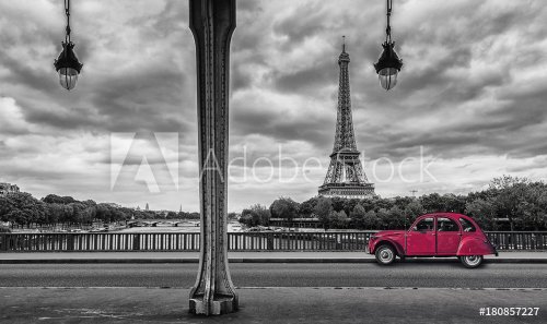Eiffel Tower with vintage Car in Paris, seen from under the Bir Hakeim Bridge - 901152982