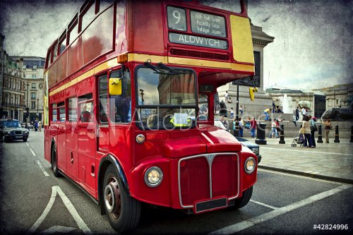 English red bus on the streets of London - 900572902