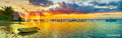 Fishing boat at sunset time. Le Morn Brabant on background. Panorama landscape - 901152326