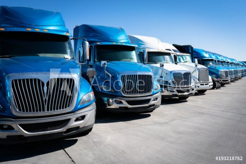 Fleet of blue 18 wheeler semi trucks - 901154268