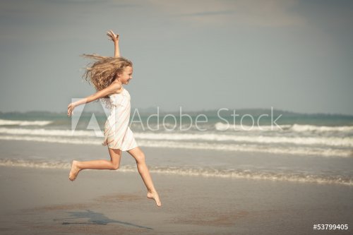 flying jump beach girl on blue sea shore in summer vacation - 901144124