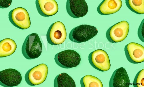 Fresh avocado pattern on a green background flat lay - 901151030