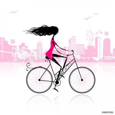 Girl cycling in the city - 900459084