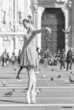Girl dancing near Milan Cathedral Square black and white - 901146619