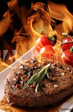 Grilled meat with fire flames - 900437747