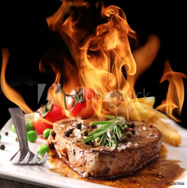Grilled meat with fire flames - 900444117