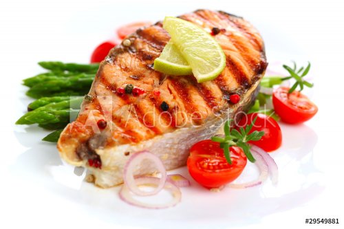 Grilled salmon with lime, asparagus and cherry tomatoes on white - 900099682