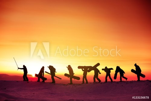 Group team snowboarder ski concept sunset