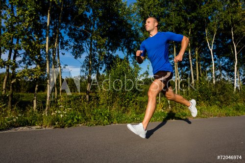 Healthy lifestyle - young man running - 901145978