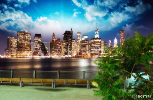 Manhattan skyline at night as seen from Brooklyn Bridge Park - I