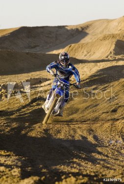 motocross racer riding on dirt track