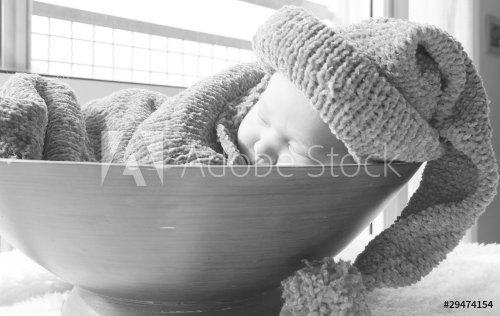 newborn in a knitted cocoon and hat - 900590474