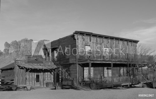 Old Wild West Cowboy town mountains in background in black and white