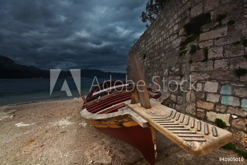 old wooden boat on coast in Korcula. Croatia. - 900458203