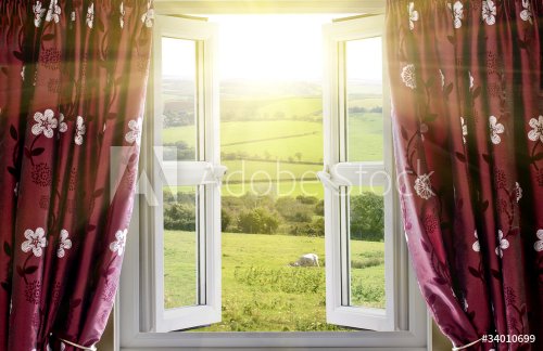Open window with countryside view and sunlight streaming in - 901145583
