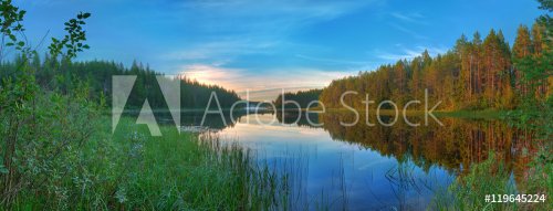 Panoramic beautiful landscape of the lake surrounded by forest at dawn. - 901148219