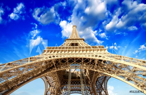 Paris. Powerful structure of Magnificent Eiffel Tower at sunset - 901139069