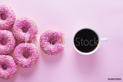 Pink and white donuts with celebration item on pink background - 901152457