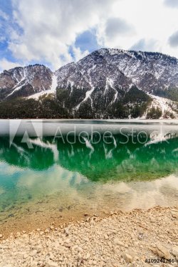 Plansee lake frozen on the end of winter, Tyrol, Austria. - 901148216