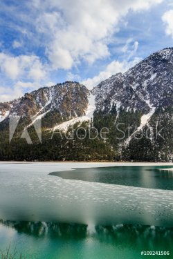 Plansee lake frozen on the end of winter, Tyrol, Austria. - 901148217