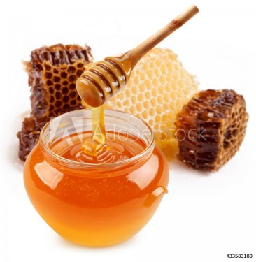 Pot of honey and wooden stick.