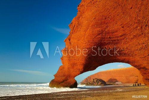Red archs on atlantic ocean coast. Marocco