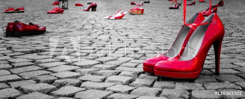 red shoes to stop violence against women on a city square - 901152804