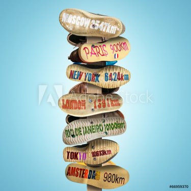 Signpost is made of old worn shoes, the distance to the cities - 901143295