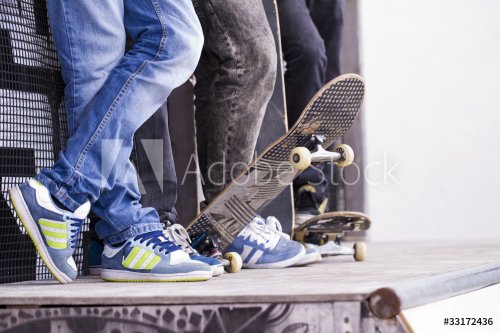 skate boarders on a pipe - 901144398