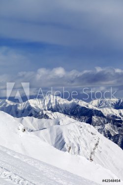 Ski slope and snowy mountains - 900454055
