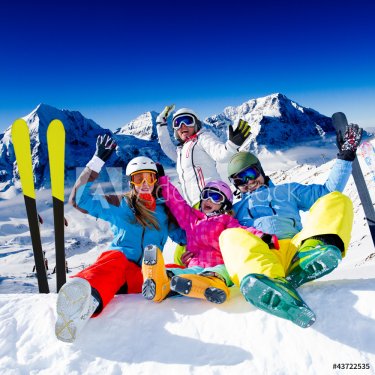 Skiing, winter fun - happy family ski team - 900561624