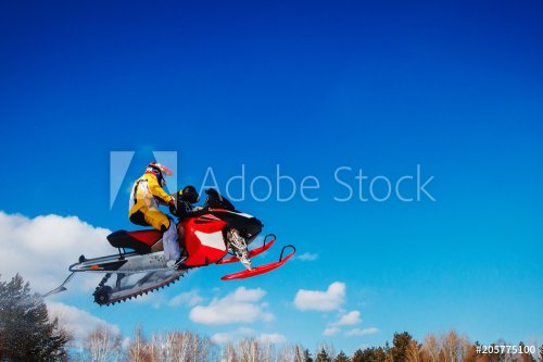 Snowmobile races jump in snow. Concept winter sports. - 901151606