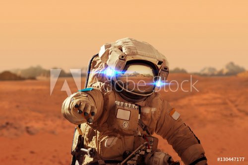 Spaceman walks on the red planet Mars. Space Mission. Astronaut - 901152176