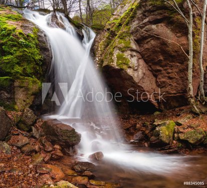 Spring time view of a waterfall among red rocks near Montana, Bulgaria
