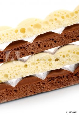 Stack of brown and white porous chocolate - 900673757