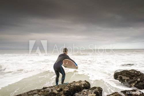 Surfer Leaping in to Ocean - 901148762