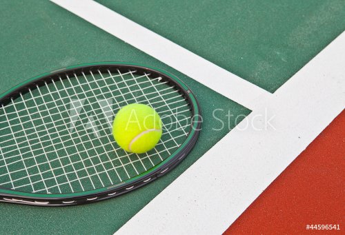 Tennis court at base line with ball and racket - 900663588