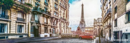 The eiffel tower in Paris from a tiny street with vintage red 2cv car - 901153972