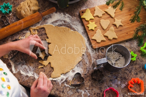 The process of cooking traditional gingerbread for Christmas. Ingredients for cookies and pastries on the table.