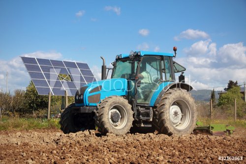 tractor farming in field - 900045800