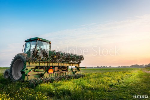 Tractor in a field on a rural Maryland farm - 901148832