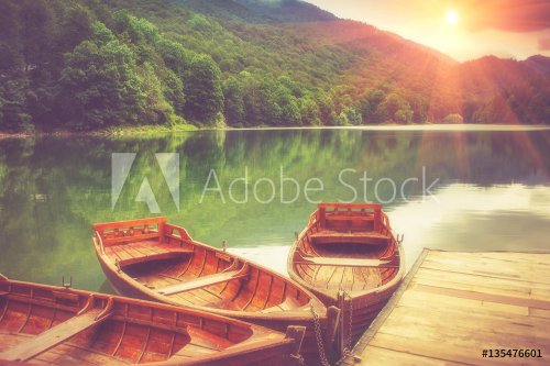 View of glacial mountain Lake Biogradsko, wooden pier and boats in forest. Bi... - 901149837