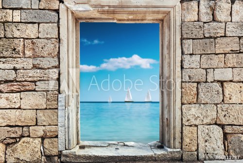 wall of stones with a hole under the door on a background of a s
